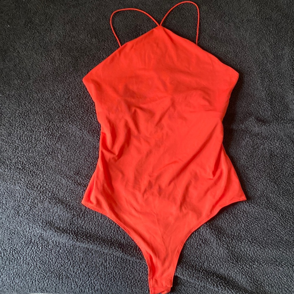 H&M orange bodysuit. Brand new !!